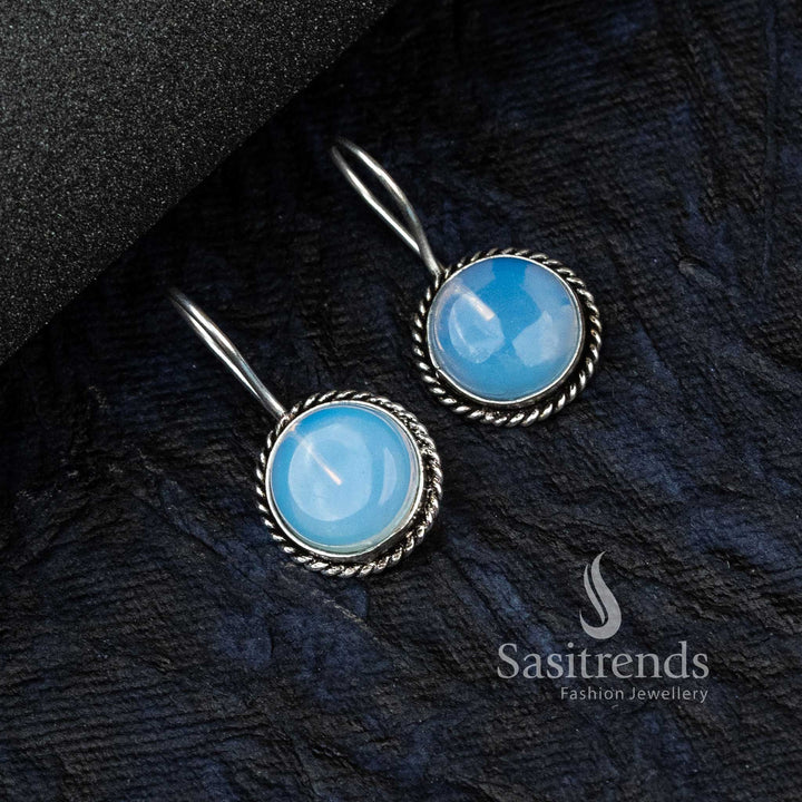 Dreamy Sky-Blue Oxidised German Silver Circular Earrings Adorned With Intricate Motifs And A Glowing Monalisa Stone – Trendy Jewellery For Contemporary Looks - Sasitrends