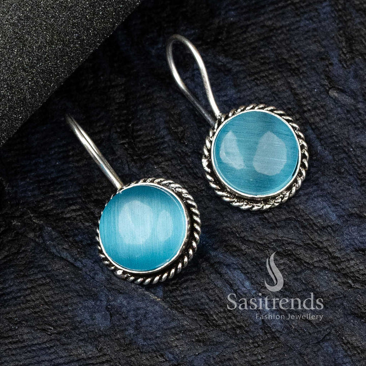 Dreamy Sky-Blue Oxidised German Silver Circular Earrings Adorned With Intricate Motifs And A Glowing Monalisa Stone – Trendy Jewellery For Contemporary Looks - Sasitrends

