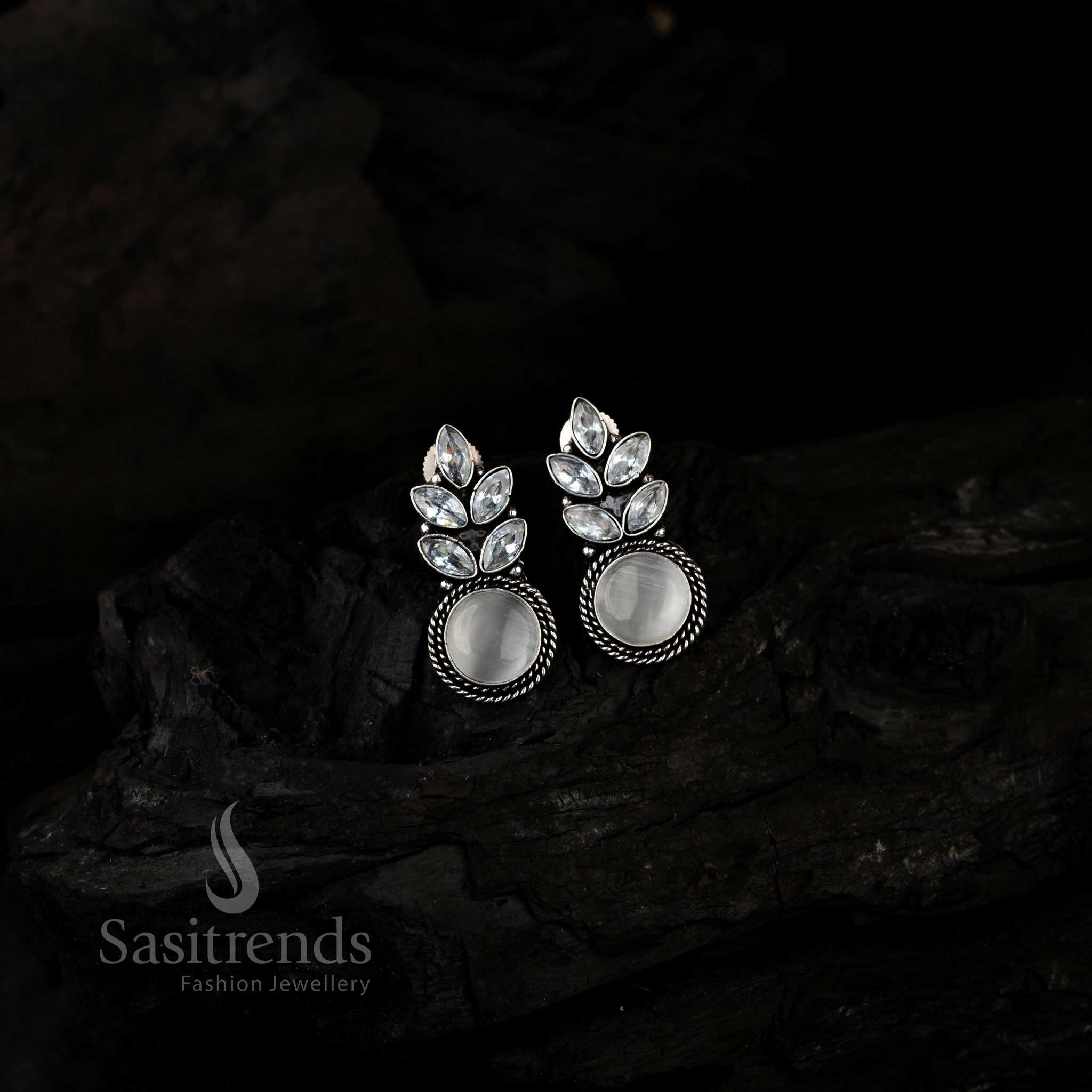 Elegant White Monalisa Stone Leaf Design Earrings With Oxidised Silver Finish And Shimmering AD Accents – A Trendy Yet Chic Statement Jewellery Piece From Sasitrends