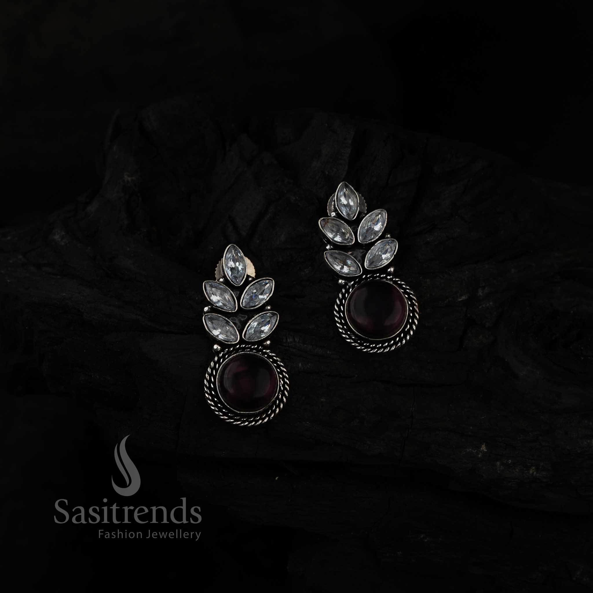 Mystic Violet Monalisa Stone Leaf Earrings In Oxidised Silver Adorned With Dazzling AD Stones – Enchanting And Trendy Jewellery Piece By Sasitrends

