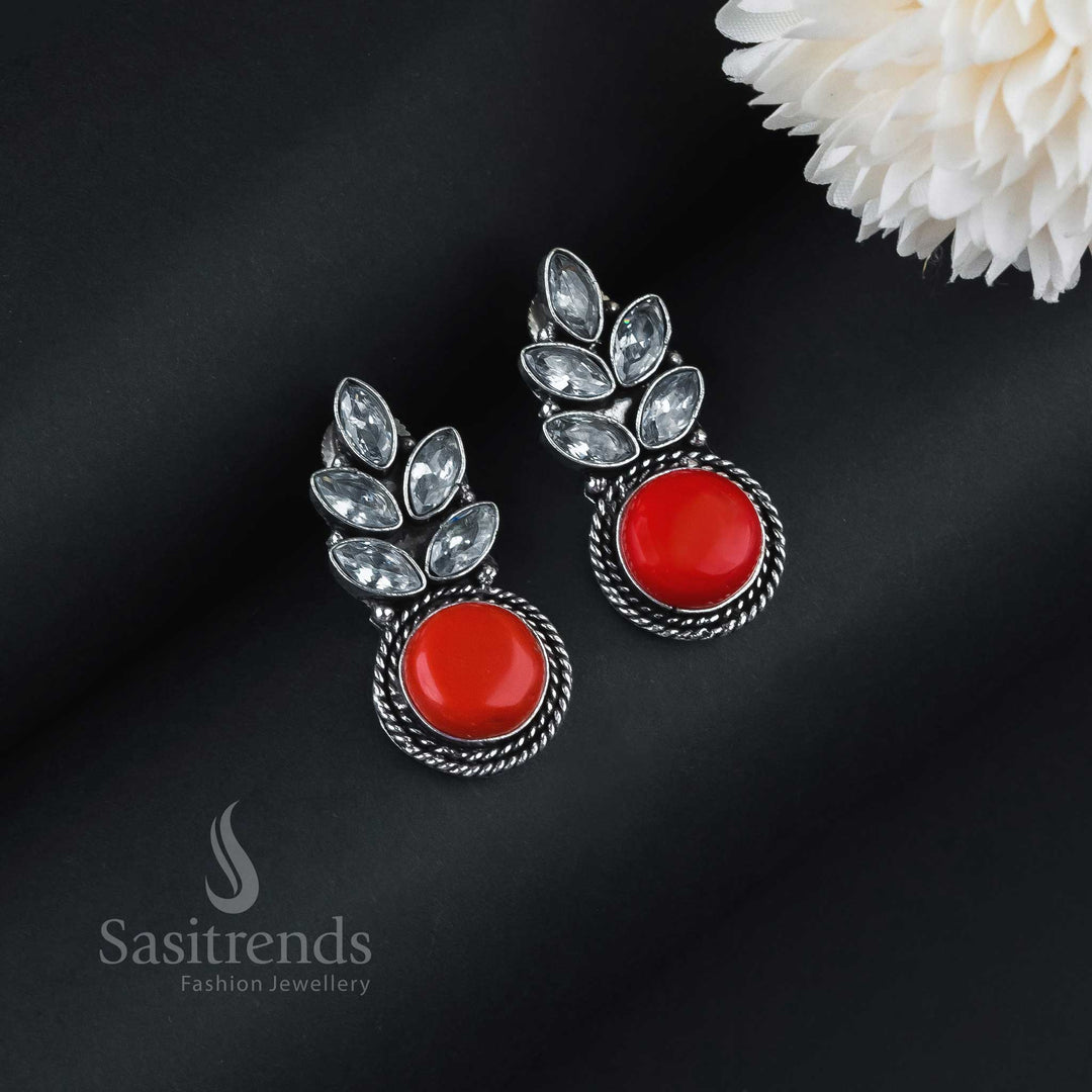 Vibrant Red Monalisa Stone Earrings In Leaf Pattern Crafted With Oxidised Silver And Gleaming AD Stones – Perfect For Festive And Occasion Wear Jewellery By Sasitrends