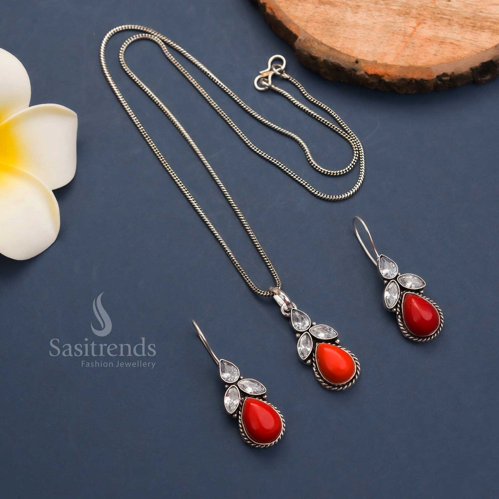 Red oxidised pendant chain necklace with floral design, Monalisa stone centre and American diamond accents – matching hook earrings – latest fashion jewellery – Sasitrends