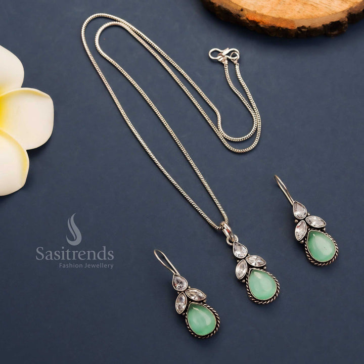 Soft mint oxidised floral pendant necklace set with dazzling AD stones and hook earrings – trendy traditional jewellery – Sasitrends