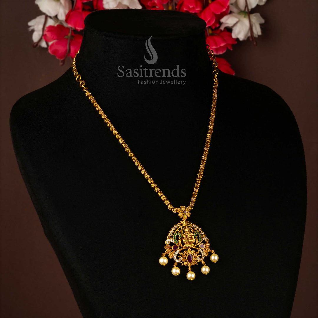 Premium matte gold plated Lakshmi pendant chain jewellery enriched with sparkling ruby American Diamonds and delicate pearl drops – a sacred heritage ornament for bridal rituals, festive events, and temple-inspired celebrations – Sasitrends