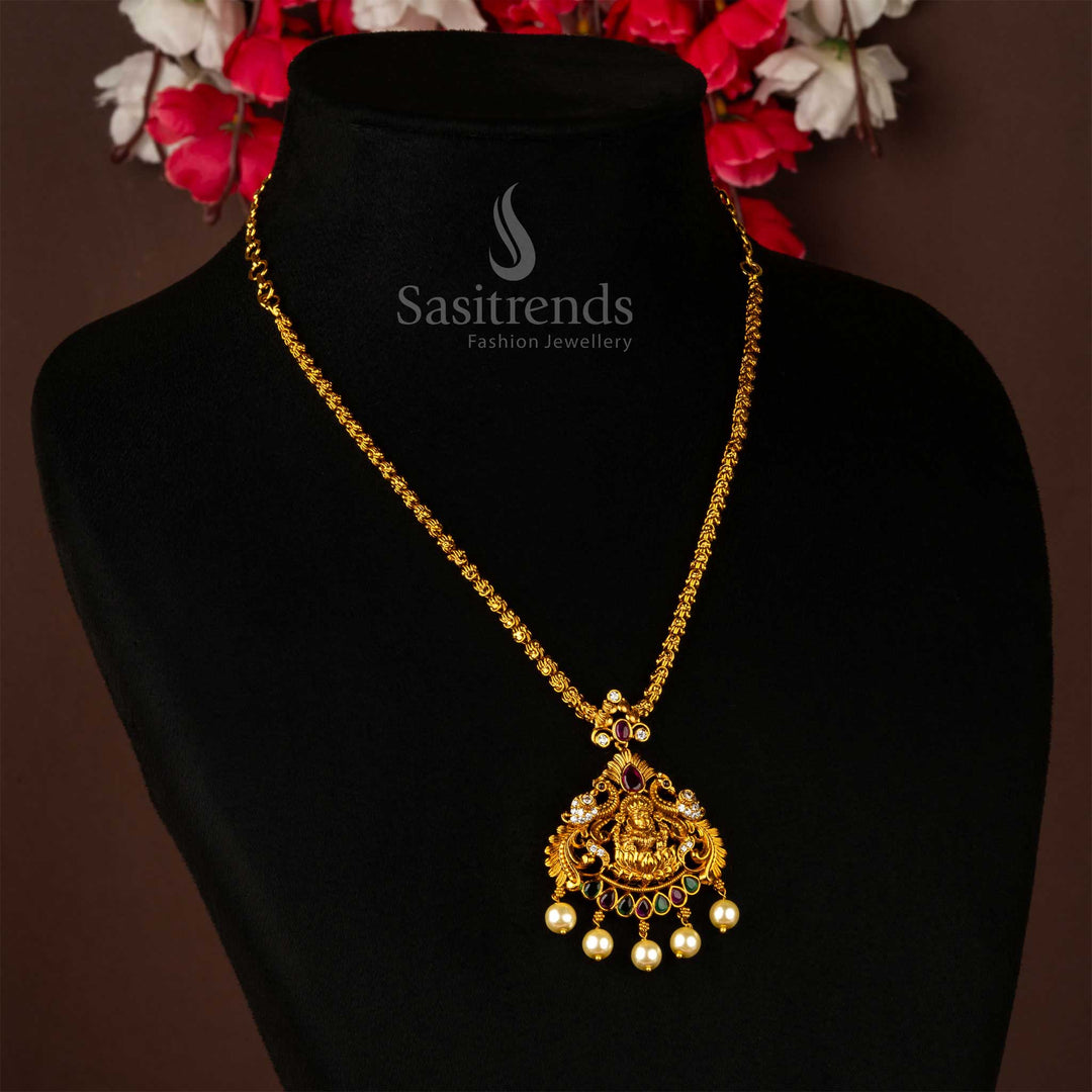 Matte gold plated chain jewellery set with a stunning designer pendant uniting Lakshmi's divine presence and the elegance of a peacock – an ethnic masterpiece ideal for South Indian weddings, poojas, and regal saree styling – Sasitrends