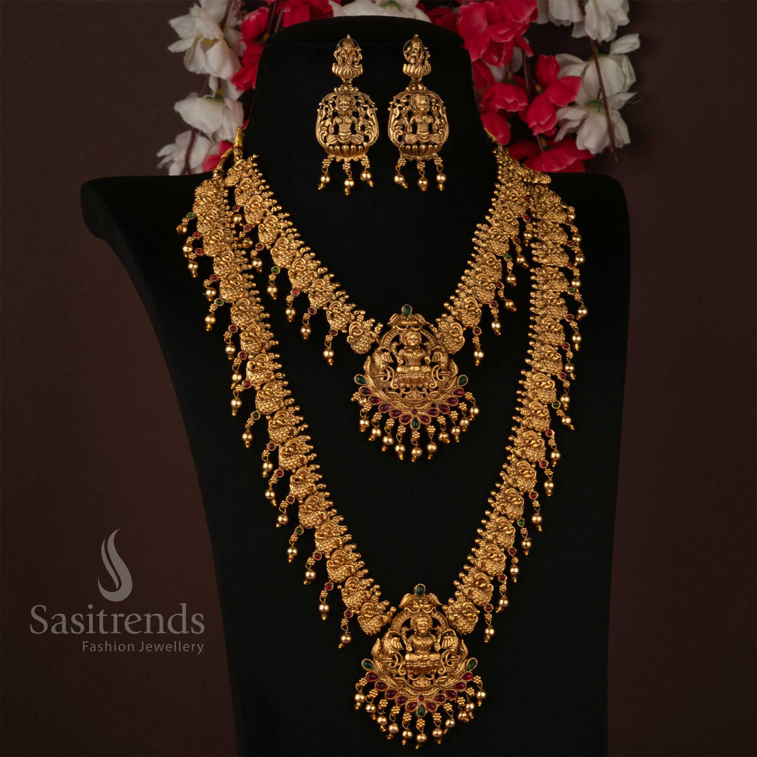 Lakshmi temple combo necklace set featuring a majestic goddess pendant with an intricately crafted layered chain, radiating timeless temple artistry – a regal traditional jewellery design perfect for bridal and ceremonial elegance – Sasitrends