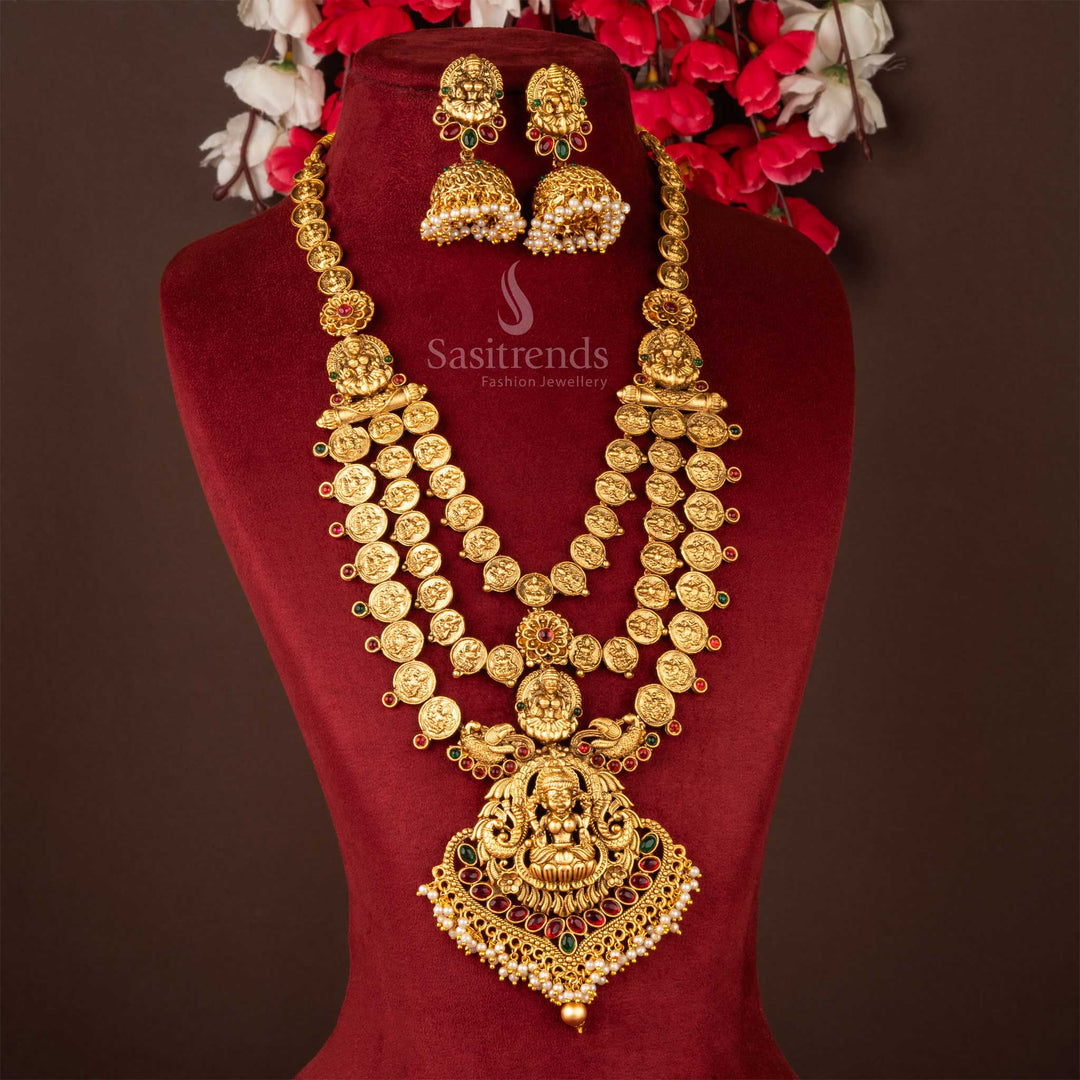 Ornate classic matte gold elegant Lakshmi pendant long chain jewellery set with elaborate craftsmanship and dazzling matching Jhumka, embodying rich South Indian heritage from Sasitrends