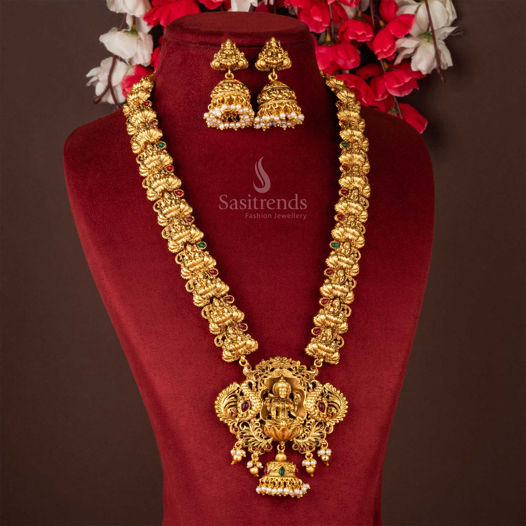 A majestic Divine Lakshmi pendant necklace jewellery set featuring a regal design and sparkling matching Jhumka, classic matte gold plated, a true statement piece for traditional wear from Sasitrends