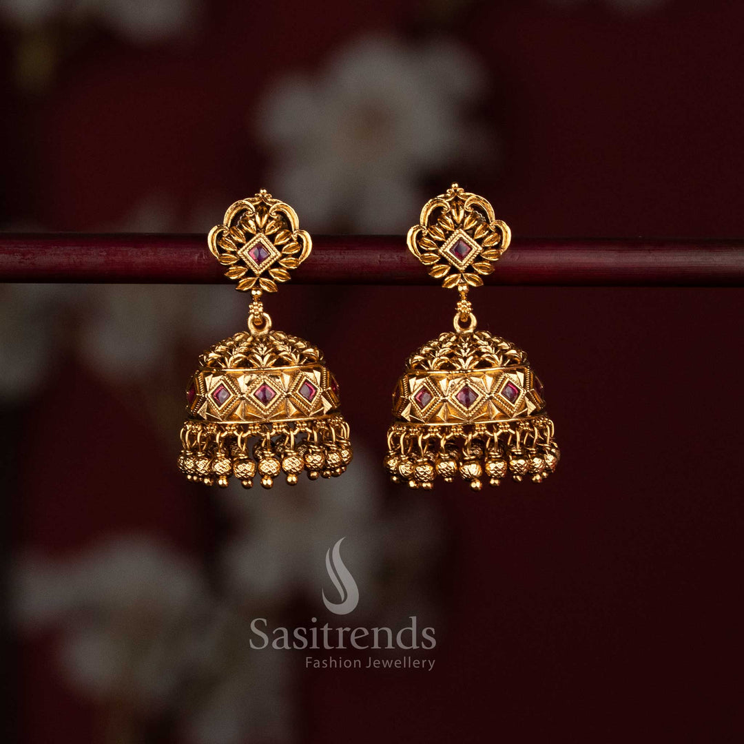 Matte gold temple jhumkas with ruby stones and hanging golden beads - Sasitrends