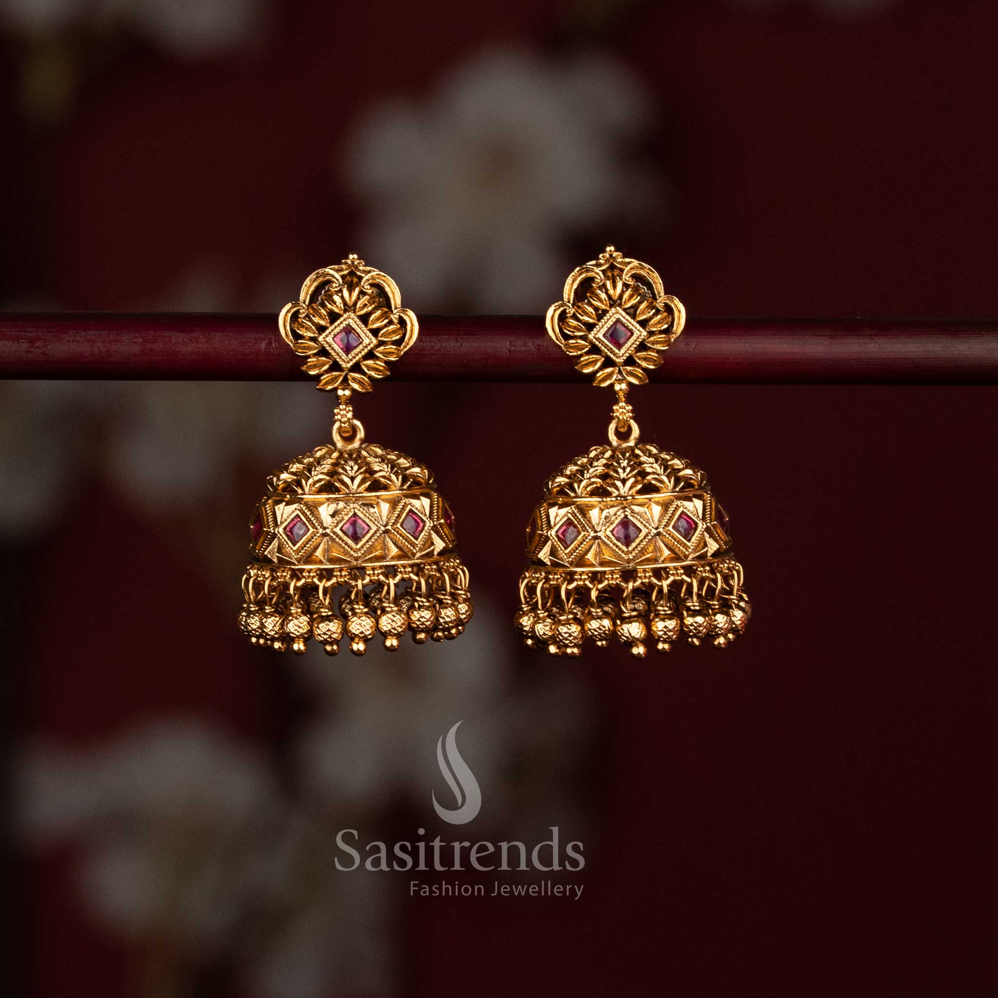 Matte gold temple jhumkas with ruby stones and hanging golden beads - Sasitrends