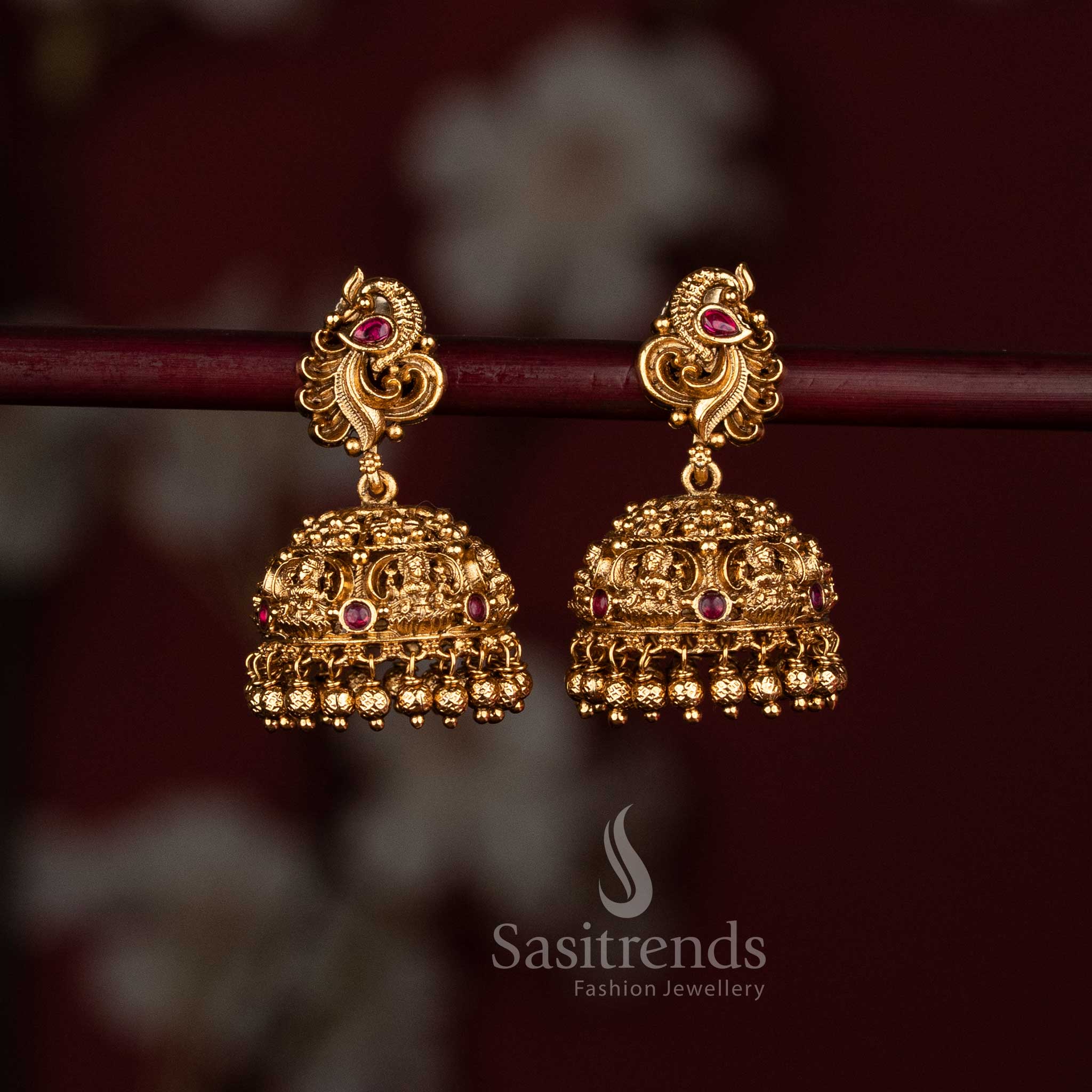 Premium matte gold temple jhumkas with intricate design and hanging golden beads - Sasitrends