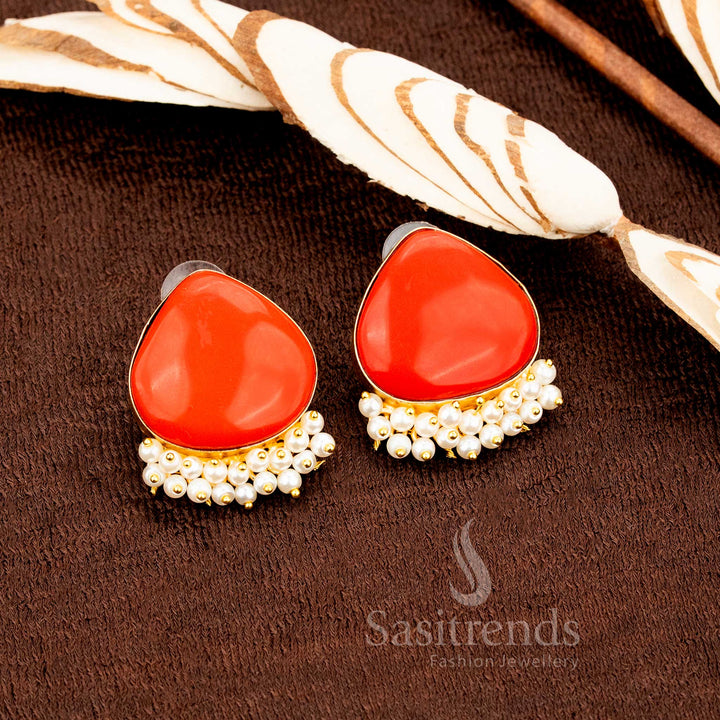 Ethnic gold plated orange Monalisa stone earrings with shimmering pearl accents, bringing festive sparkle and casual jewellery glow with vibrant traditional flair by Sasitrends