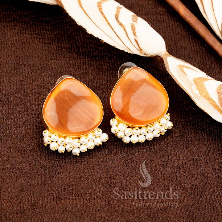 Grand ethnic style earrings crafted in luxurious gold finish with dark yellow Monalisa stones and pearl charm, perfect for wedding jewellery statements and celebratory occasions by Sasitrends