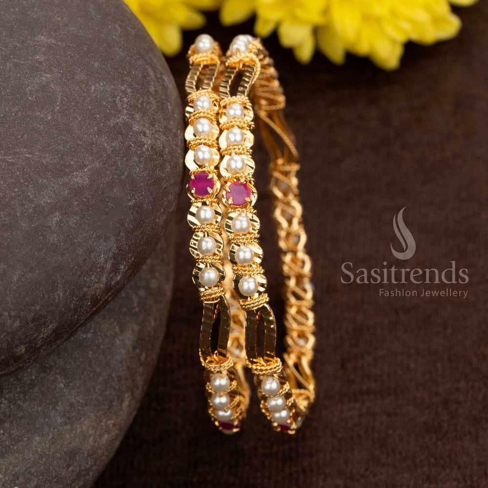 Traditional one gram micro gold plated pearl bangles in ruby colour with sparkling AD stone centrepiece, perfect for grand festive occasions and bridal ensembles – Sasitrends

