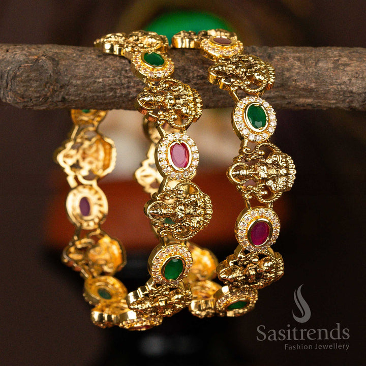 Temple Wear Matt Golf Plated Lakshmi Motif Ruby Green AD Stone Studded Bangles Sasitrends