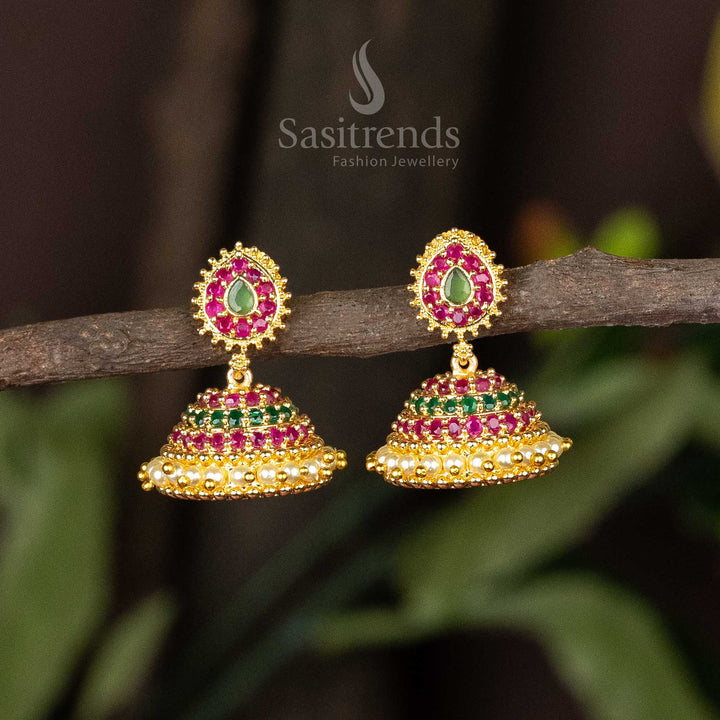 Classic micro gold ruby-green jhumkas with AD stones and layered pearl hangings – ideal for festive occasions and traditional looks – Sasitrends