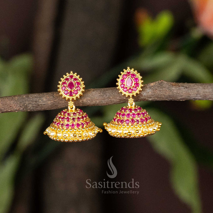 Timeless elegance micro gold plated ruby AD stone pearl jhumka earrings with ornamental floral design and traditional pearl drop hangings – perfect for ethnic celebrations – Sasitrends