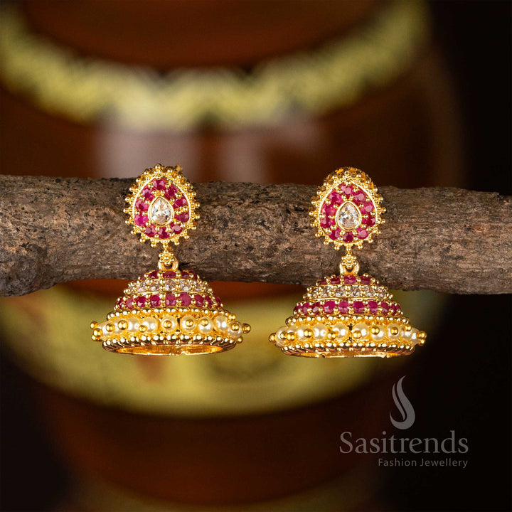 Ornate micro gold plated white-ruby jhumkas with vintage AD stone design and structured pearl drops – perfect for wedding function style – Sasitrends