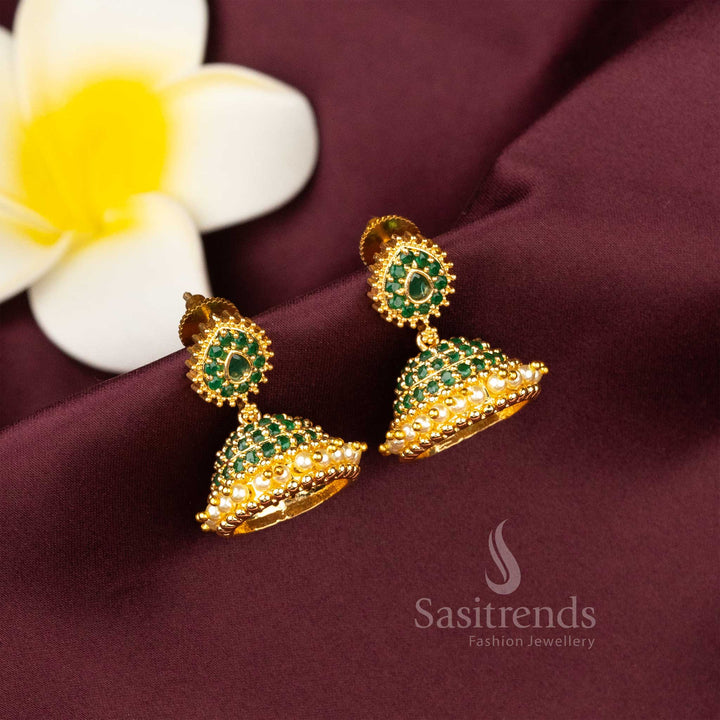 Festive green micro gold plated jhumkas featuring sparkling AD stone highlights and tiered pearl decorations – ideal for celebration wear – Sasitrends
