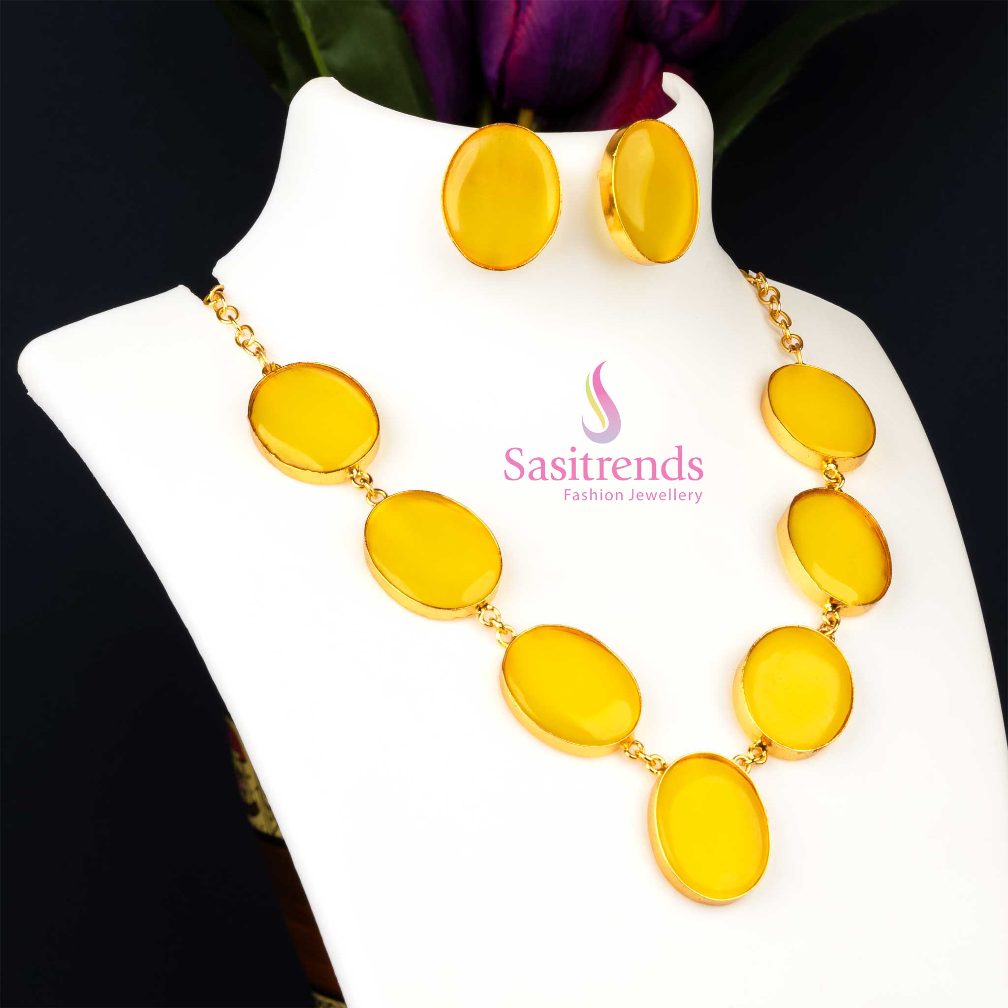 Bright gold plated Monalisa stone feather jewellery set in a cheerful yellow like a golden sunbeam, adding playful sparkle to party wear collections from Sasitrends