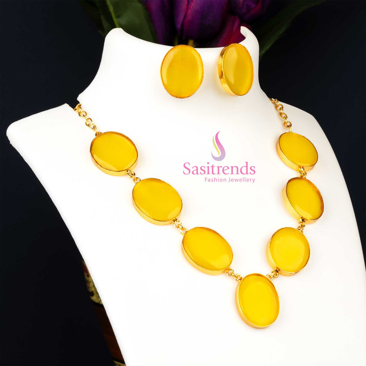 Bright gold plated Monalisa stone feather jewellery set in a cheerful yellow like a golden sunbeam, adding playful sparkle to party wear collections from Sasitrends