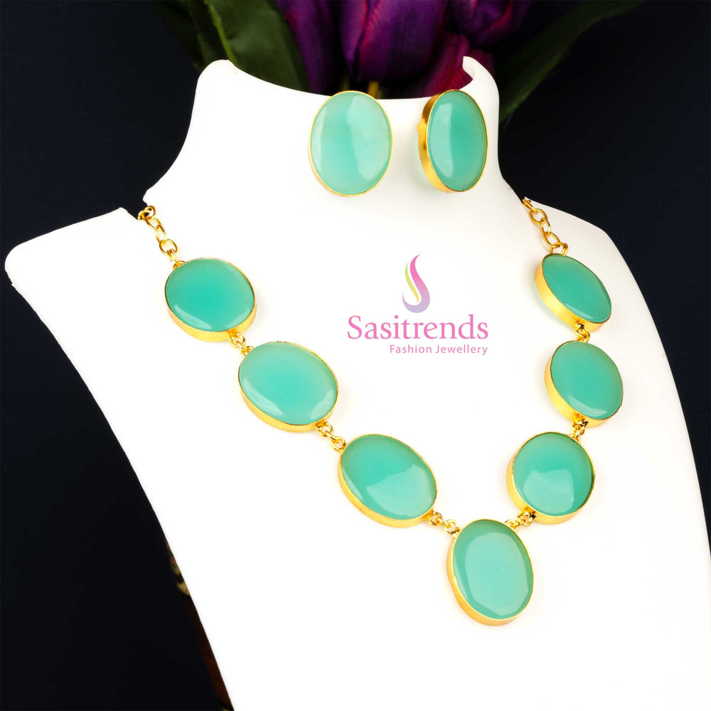 Contemporary gold plated Monalisa stone feather jewellery set in a soothing fresh mint hue, capturing a breezy style ideal for party wear collections from Sasitrends