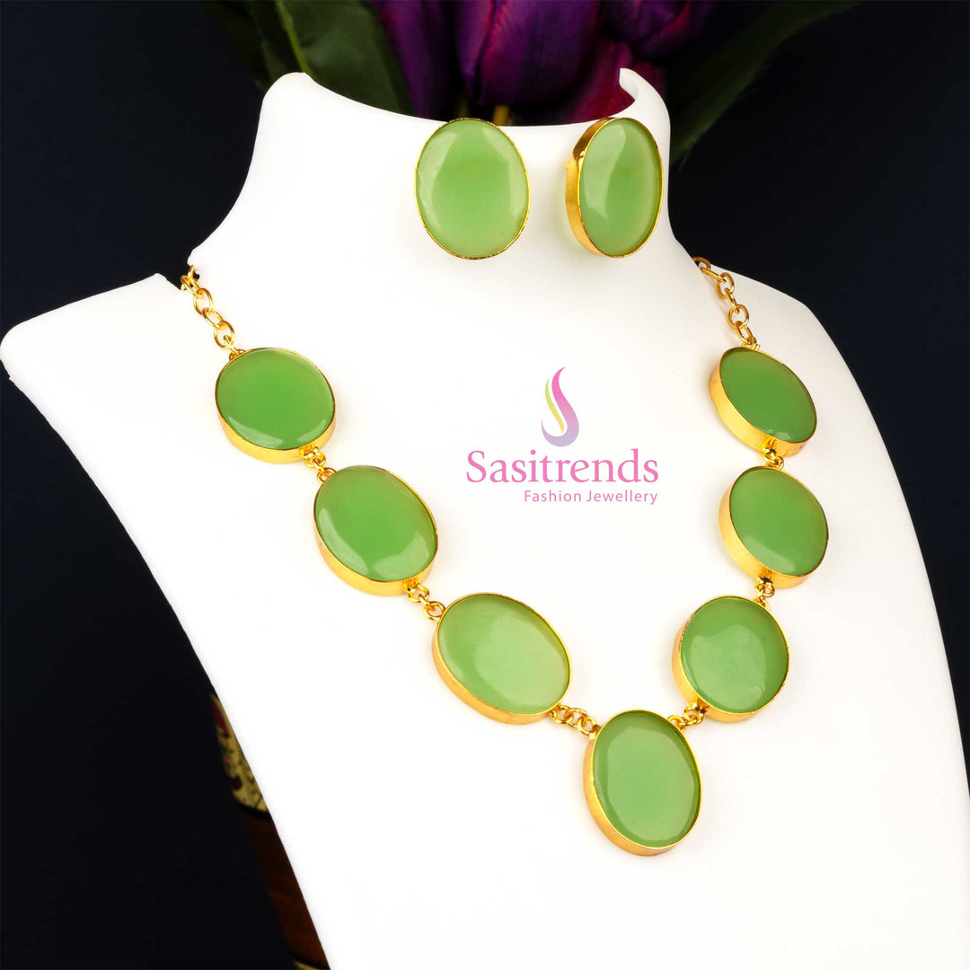 Stylish gold plated Monalisa stone feather jewellery set in a vibrant verdant green, perfect for party wear collections, offering a fantasy-like elegance from Sasitrends