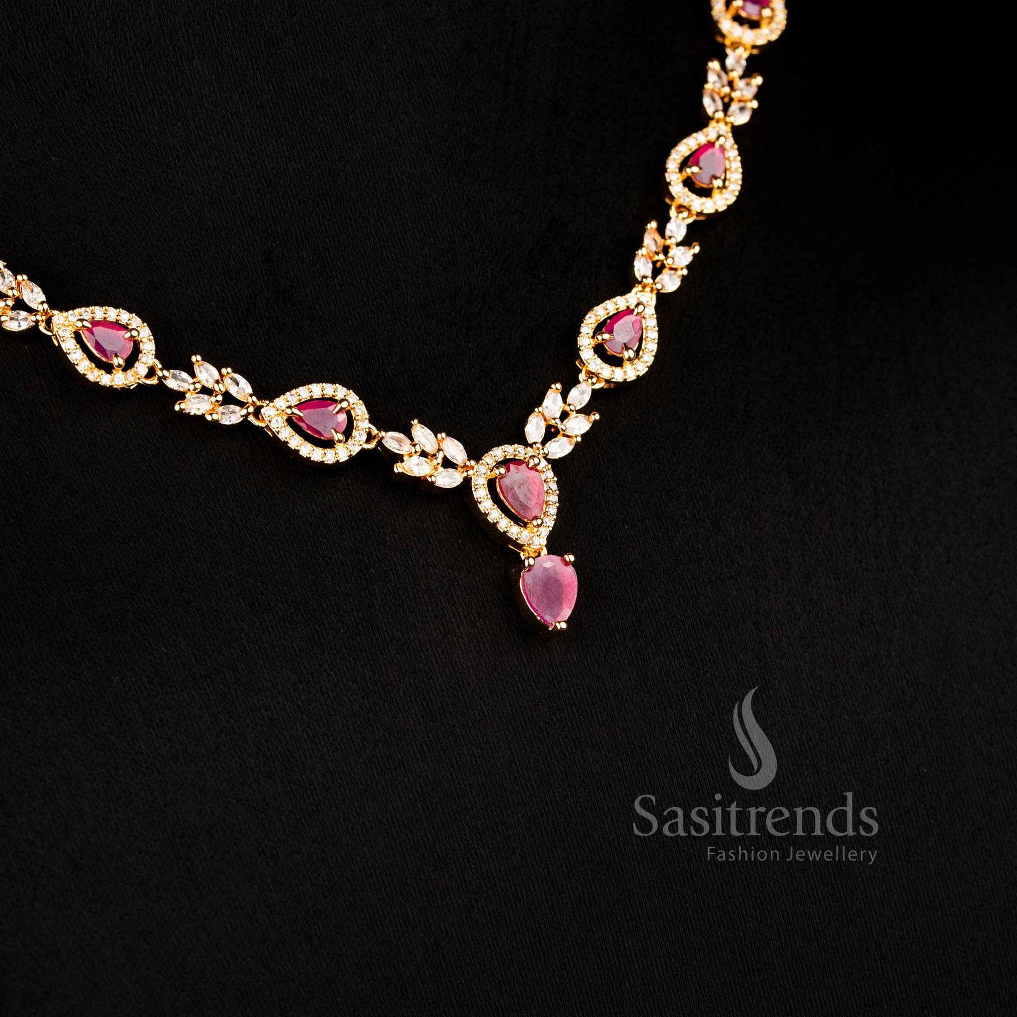 Teardrop design AD necklace set with ruby stones and gold finish jewellery set