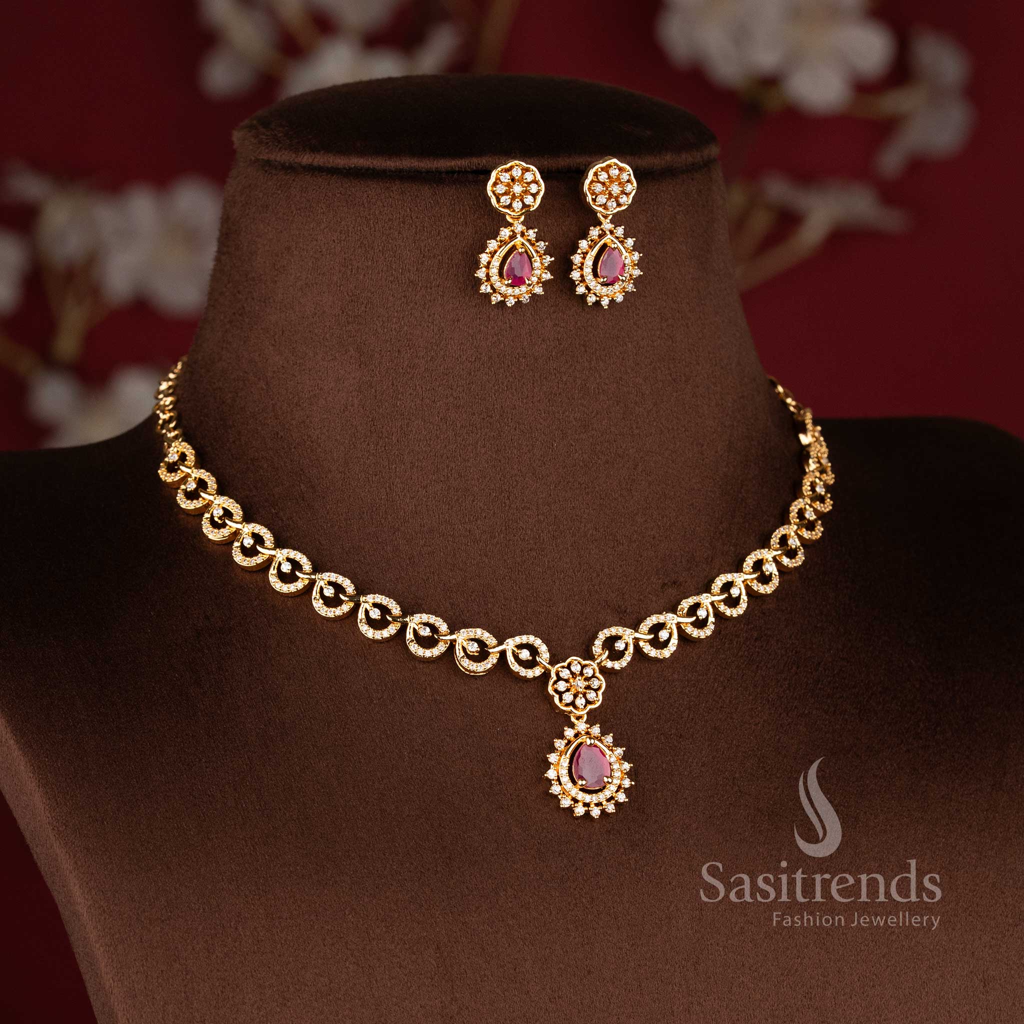 Floral Swirl Ruby American Diamond micro gold plated necklace jewellery set featuring sparkling AD stones and elegant teardrop pendant design - Sasitrends