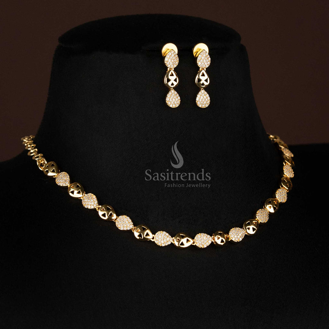 Pair of sparkling American Diamond micro gold plated drop earrings with teardrop design, part of a luxurious jewellery set.