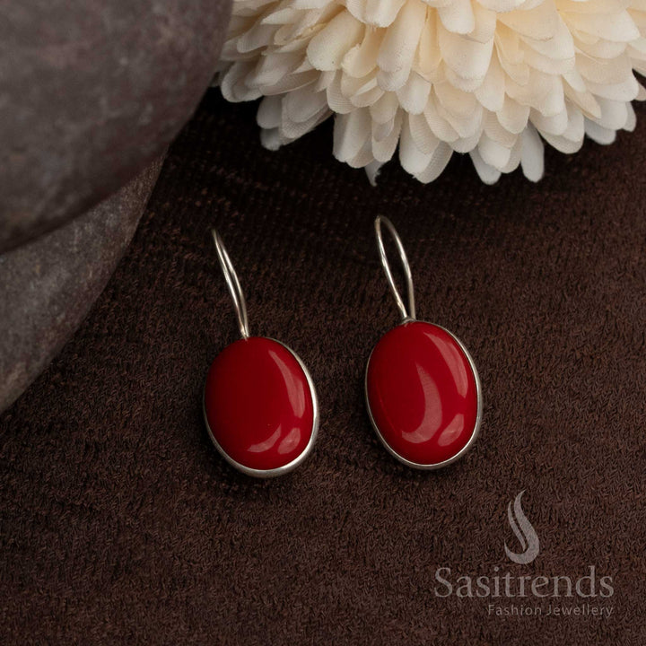 Circular oxidised earrings embedded with glowing red natural stone cores a stylish option for light festive wear or casual ethnic fusion looks from Sasitrends