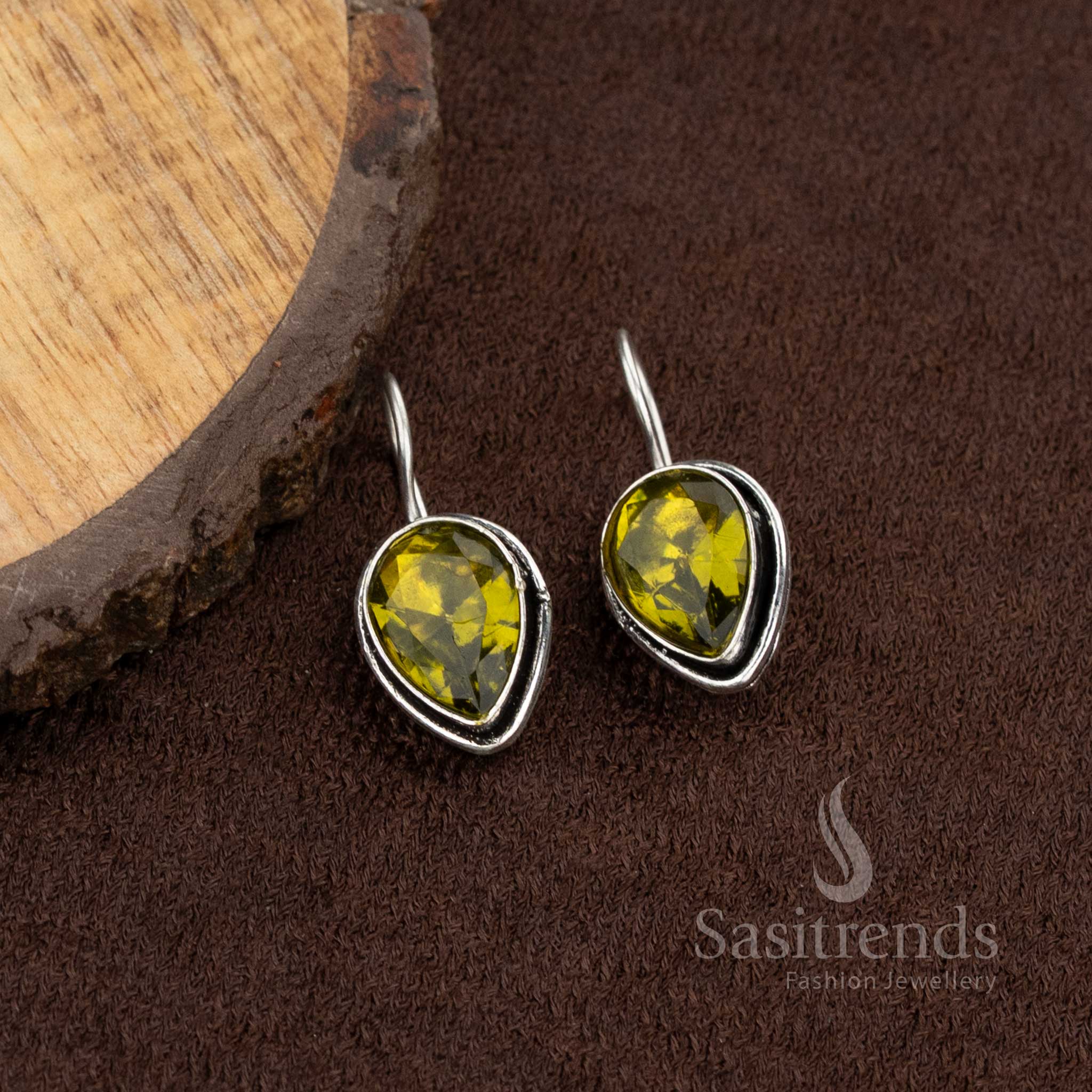 Oxidised teardrop earrings with clear olive-green stone, perfect for Navaratri styling and casual daily outfits – Sasitrends