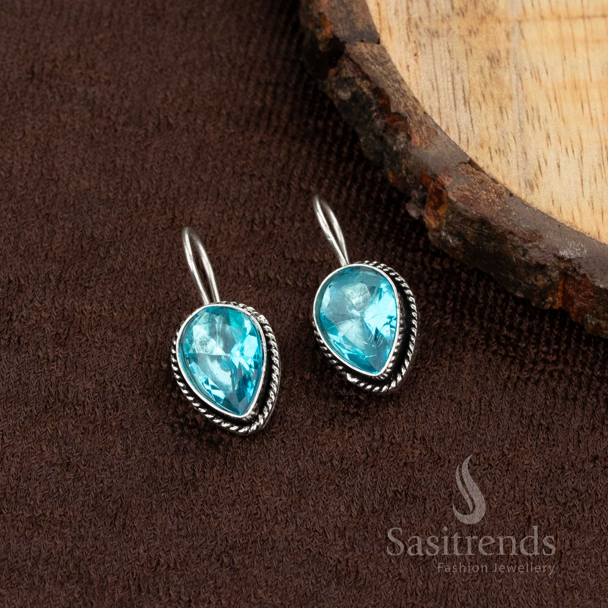 Oxidised earrings with vibrant aqua-blue stone, ideal for adding charm to casual college looks – Sasitrends