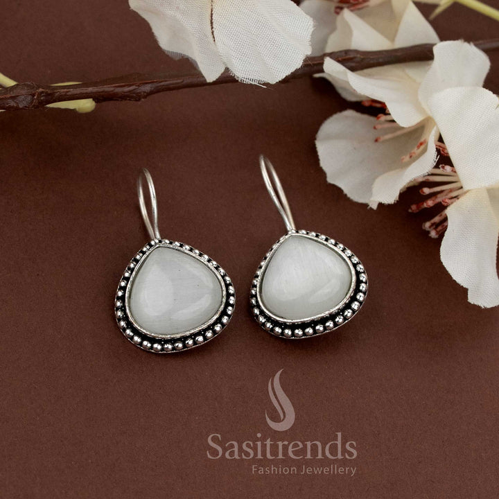 Subtle white teardrop stone earrings framed with oxidised beads ideal for daytime events and gatherings by Sasitrends