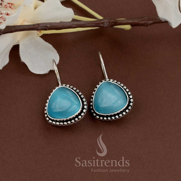 Stylish oxidised earrings featuring blue natural teardrop stones framed with beads ideal for everyday and function looks from Sasitrends