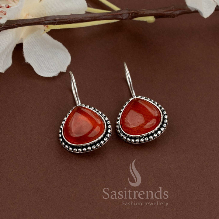 Bold Orange stone earrings with oxidised finish and beaded edge giving an elegant look for both day and evening wear by Sasitrends