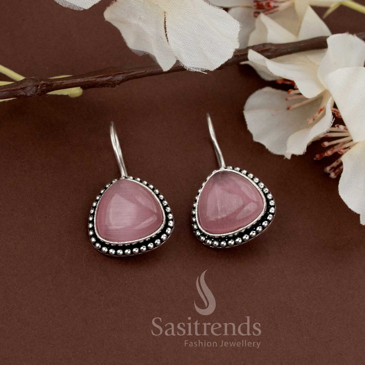 Pink teardrop earrings in oxidised metal with beaded edges suitable for daily wear and celebrations from Sasitrends
