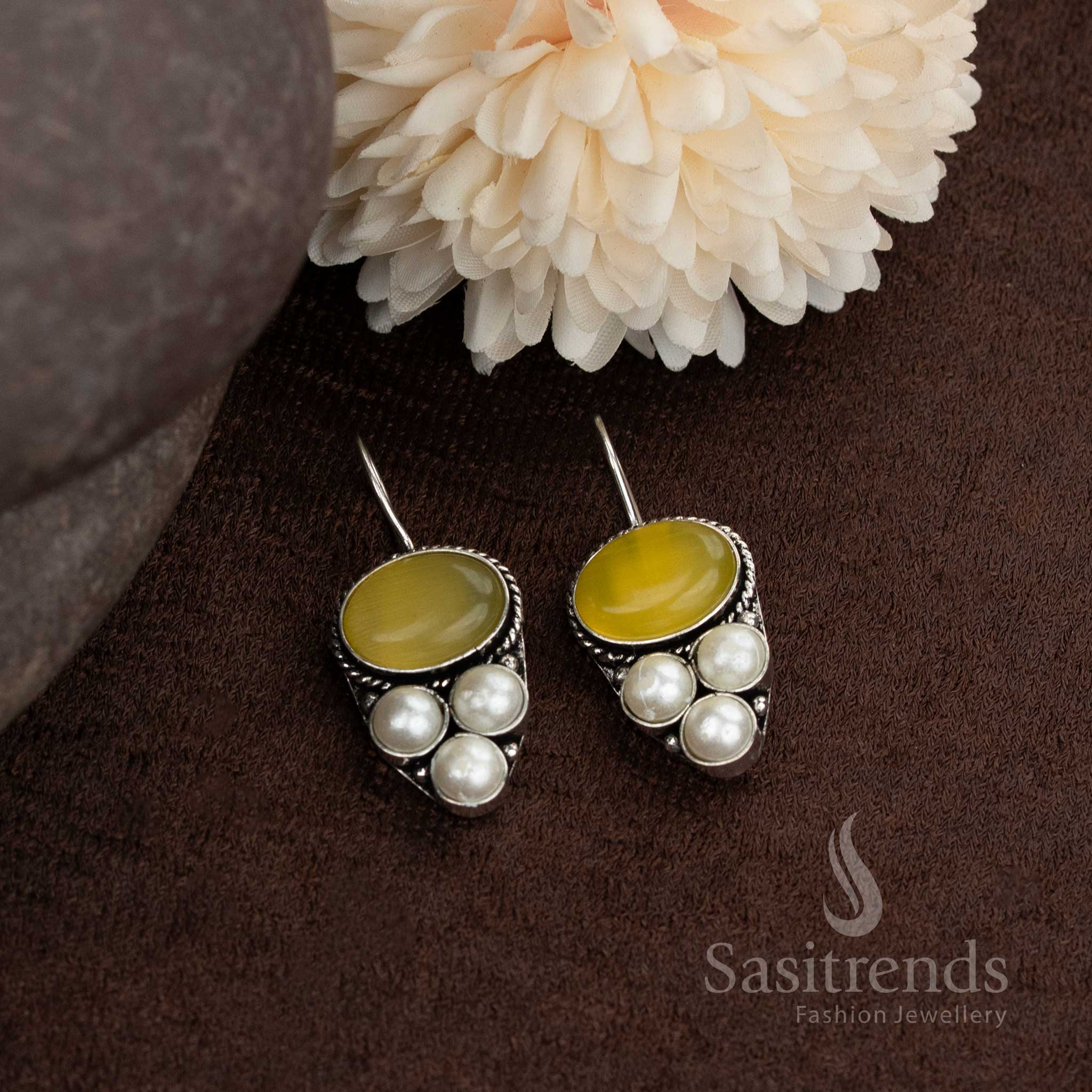 Oxidised earrings with oval natural stone and pearl design