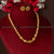 Traditional gold-plated beaded brass necklace and earrings on burgundy display