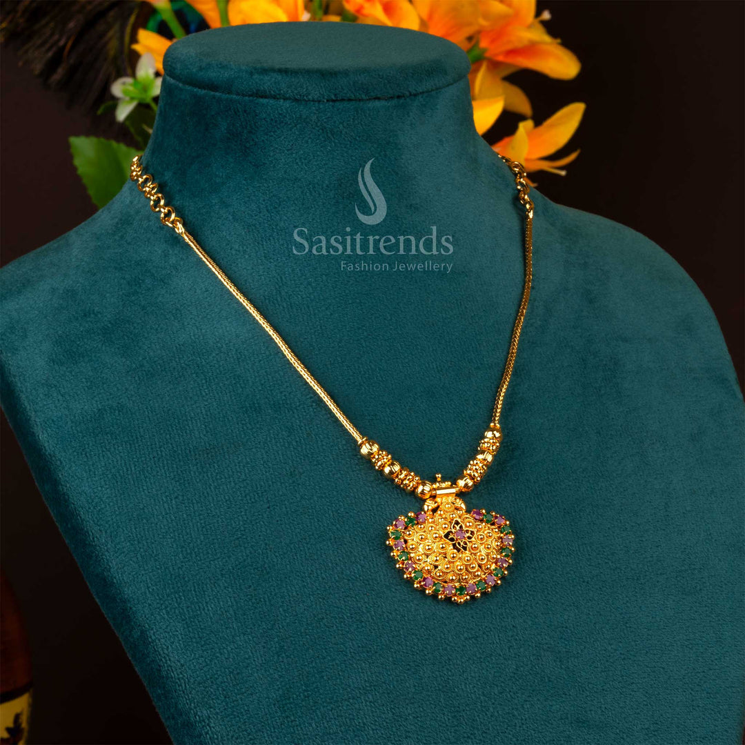 A graceful temple jewellery piece with ruby-green dual-toned pendant, elegant AD stone accents, and antique charm in one gram gold finish – Sasitrends