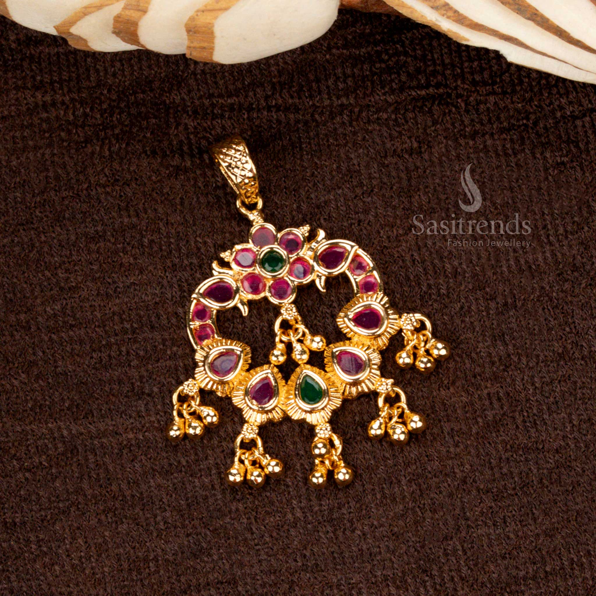 Elegant micro gold plated golden ball pendant with ruby-green dual stones and AD embellishments, radiating a regal charm - Sasitrends