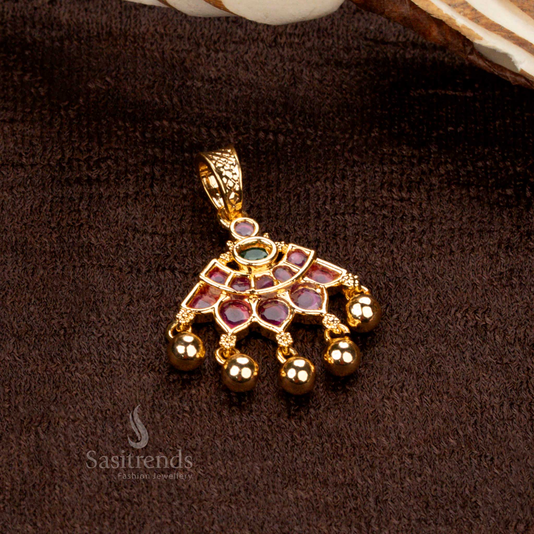 Ornate golden ball pendant with floral designs, micro gold plating, and striking ruby-green stones, perfect for festive and wedding wear - Sasitrends