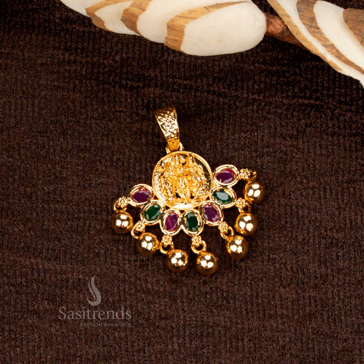 Traditional micro gold plated Lakshmi golden ball pendant, adorned with exquisite ruby and green gemstones for a divine and ethnic look - Sasitrends