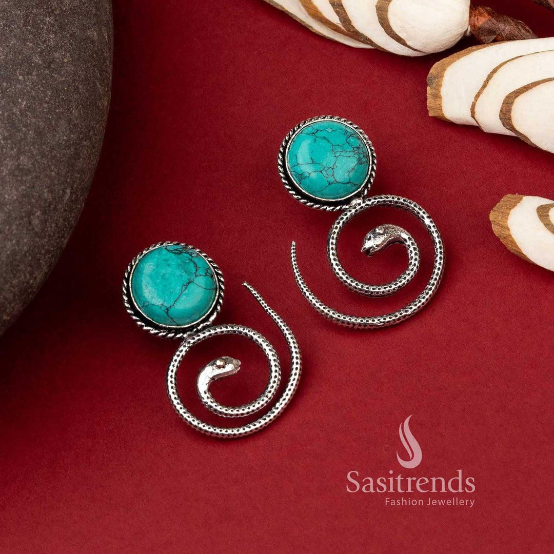 Coiled snake oxidized earrings with turquoise Monalisa stone