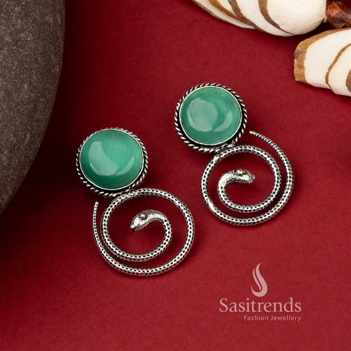 Coiled snake earrings featuring emerald Mint Monalisa stone