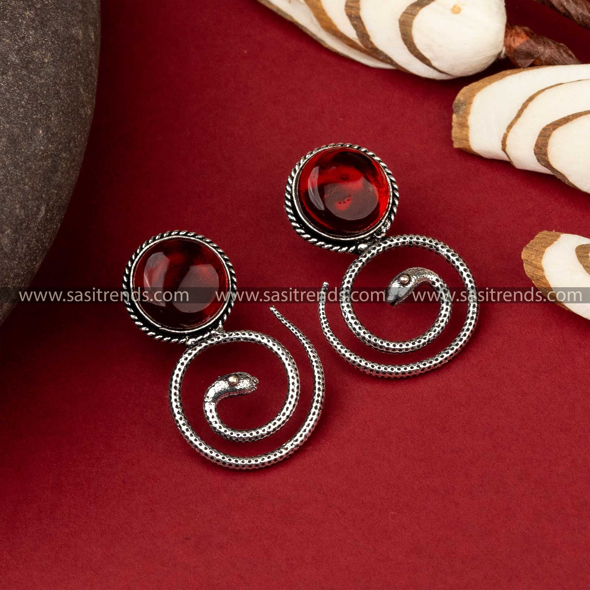 Coiled snake oxidized earrings with amber Monalisa stone