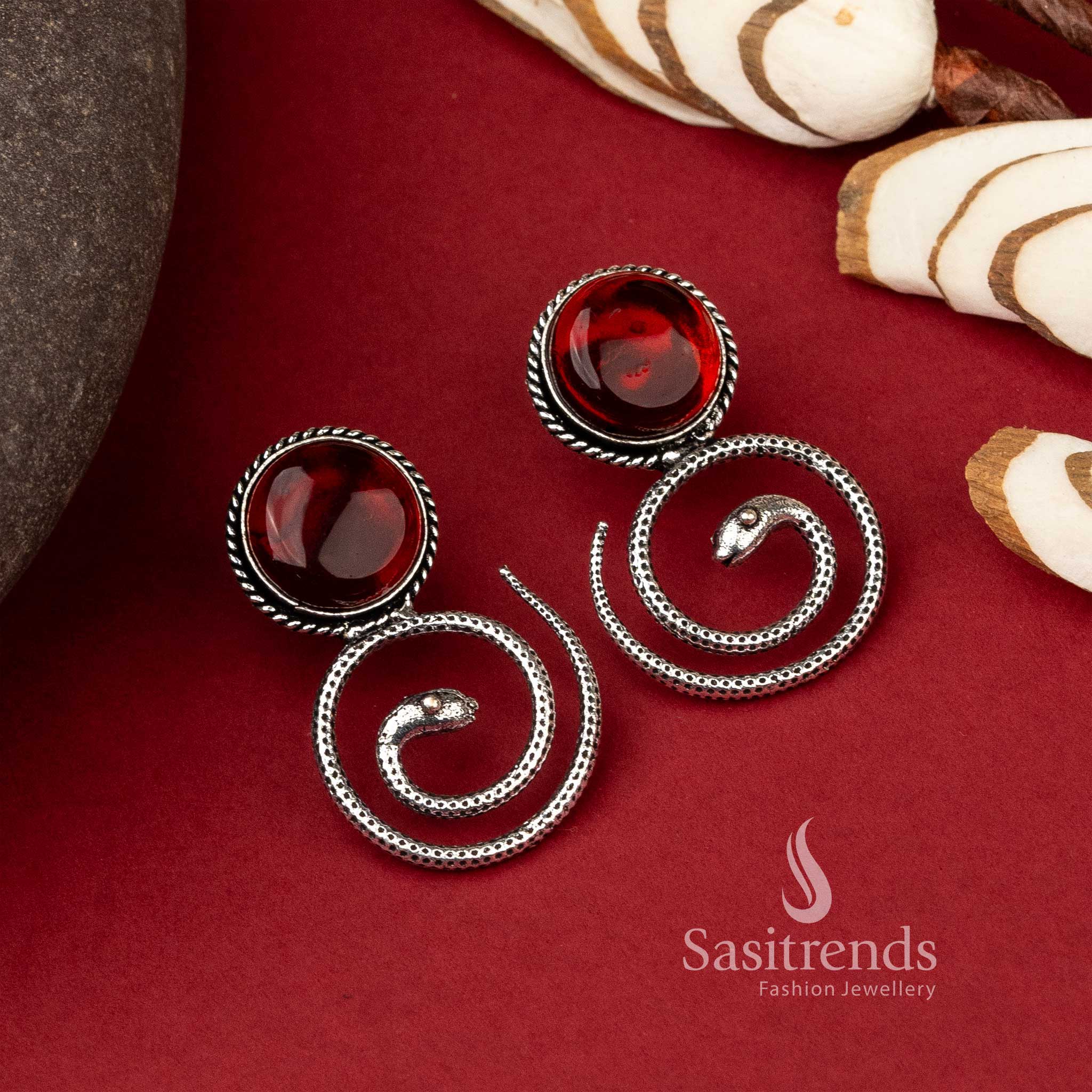 Coiled snake oxidized earrings with amber Monalisa stone
