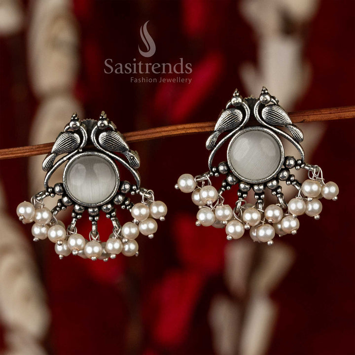 Oxidised peacock earrings with a smoky quartz centerpiece, adorned with a cascade of pearls