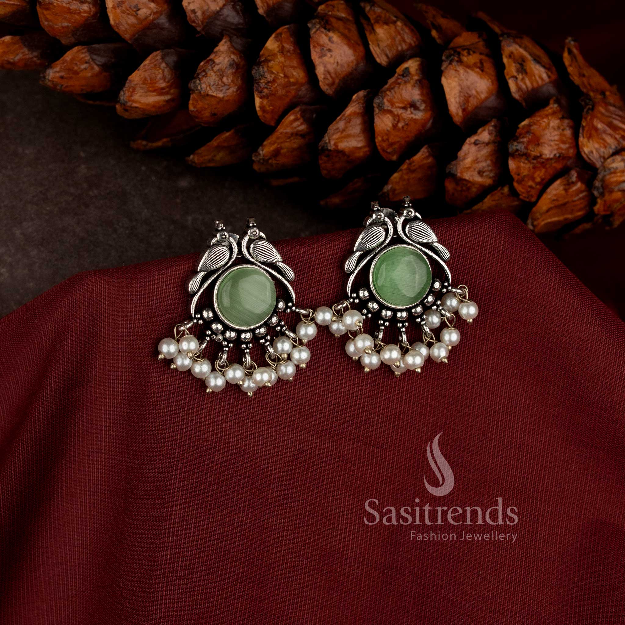  peacock design oxidised earrings with stone detailing and pearl accents Sasitrends