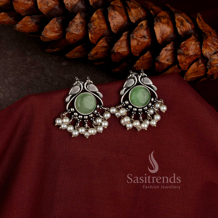  peacock design oxidised earrings with stone detailing and pearl accents Sasitrends